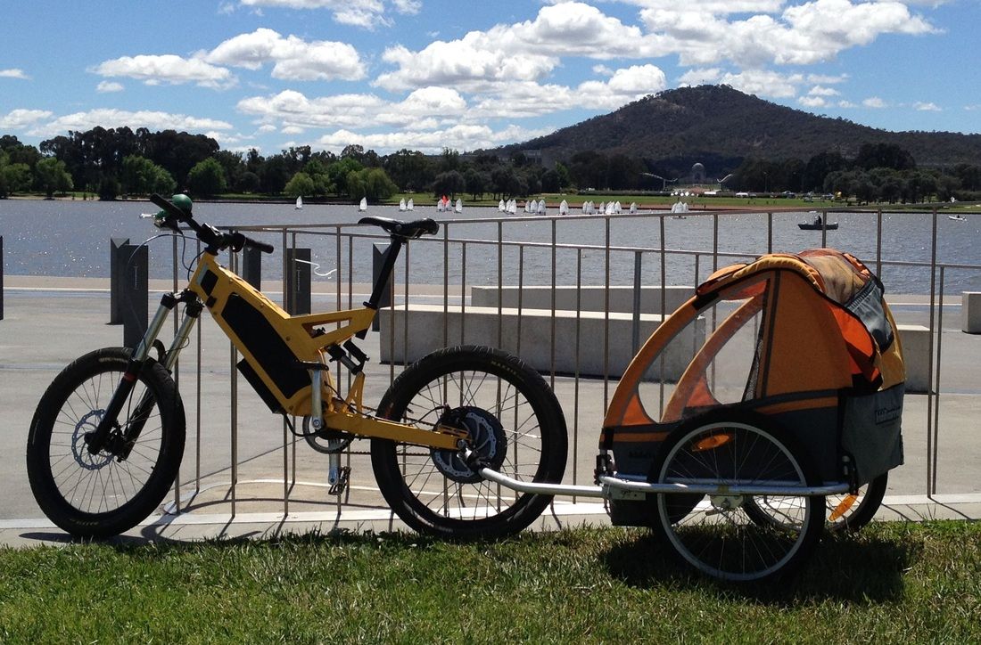 Stealth ebike fitted with kids trailer.